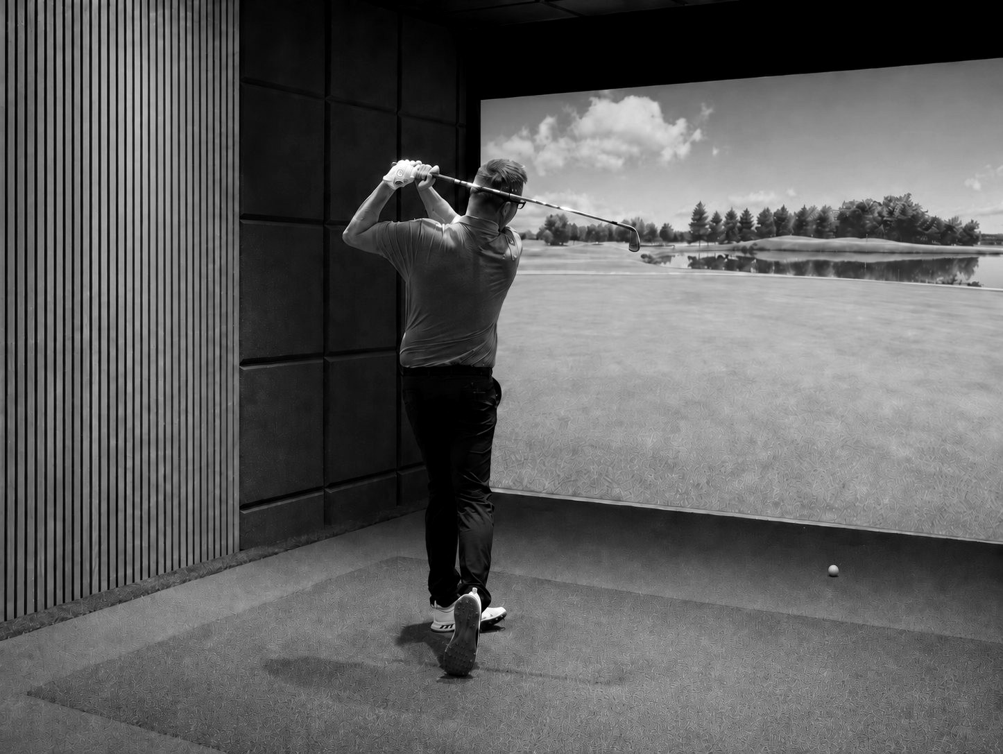 Golfer hitting a shot in the Shrewsbury School Golf Studio